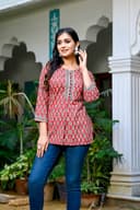 Woman wearing a black kurti set with dupatta by Nishtha Chadda