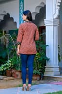 Woman wearing a navy kurti set with dupatta by Nishtha Chadda