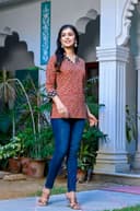 Woman wearing a navy kurti set with dupatta by Nishtha Chadda