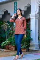 Woman wearing a navy kurti set with dupatta by Nishtha Chadda