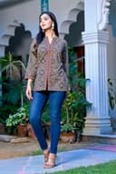 Woman wearing a red kurti set with dupatta by Nishtha Chadda