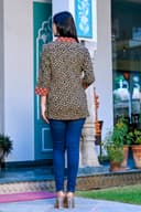 Woman wearing a navy kurti set with dupatta by Nishtha Chadda