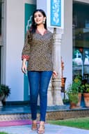Woman wearing a navy kurti set with dupatta by Nishtha Chadda