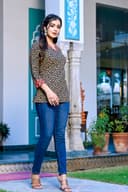 Woman wearing a navy kurti set with dupatta by Nishtha Chadda