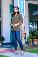 Woman wearing a navy kurti set with dupatta by Nishtha Chadda