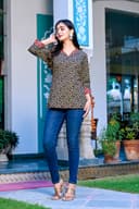 Woman wearing a navy kurti set with dupatta by Nishtha Chadda