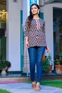 Woman wearing a navy kurti set with dupatta by Nishtha Chadda