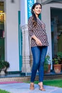 Woman wearing a navy kurti set with dupatta by Nishtha Chadda