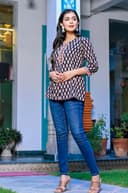 Woman wearing a navy kurti set with dupatta by Nishtha Chadda