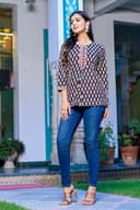 Woman wearing a navy kurti set with dupatta by Nishtha Chadda