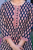 Woman wearing a navy kurti set with dupatta by Nishtha Chadda