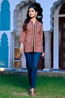 Woman wearing a black kurti set with dupatta by Nishtha Chadda
