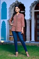 Woman wearing a black kurti set with dupatta by Nishtha Chadda