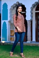 Woman wearing a black kurti set with dupatta by Nishtha Chadda