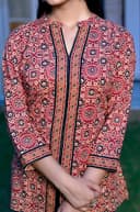 Woman wearing a black kurti set with dupatta by Nishtha Chadda