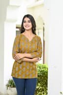 Woman wearing a olive kurti set with dupatta by Nishtha Chadda