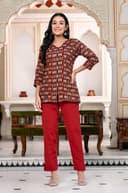 Woman wearing a maroon kurti set with dupatta by Nishtha Chadda