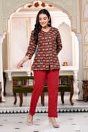 Woman wearing a maroon kurti set with dupatta by Nishtha Chadda
