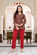 Woman wearing a maroon kurti set with dupatta by Nishtha Chadda