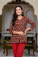 Woman wearing a maroon kurti set with dupatta by Nishtha Chadda