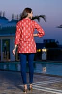 Woman wearing a navy kurti set with dupatta by Nishtha Chadda