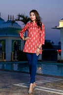 Woman wearing a navy kurti set with dupatta by Nishtha Chadda