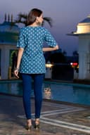 Woman wearing a navy kurti set with dupatta by Nishtha Chadda