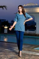 Woman wearing a navy kurti set with dupatta by Nishtha Chadda