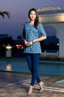 Woman wearing a navy kurti set with dupatta by Nishtha Chadda