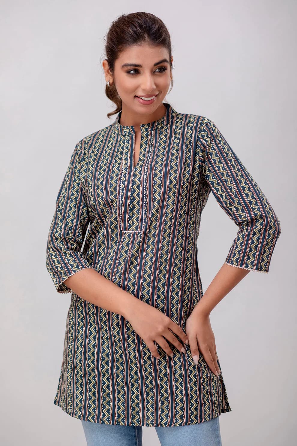 Woman wearing a grey indian kurti for women by Nishtha Chadda
