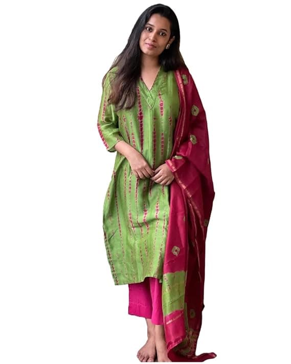 Woman wearing a maroon party wear ethnic kurta style by Nishtha Chadda