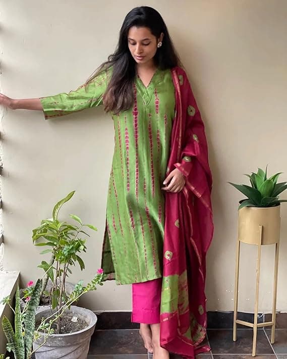 Woman wearing a maroon party wear ethnic kurta style by Nishtha Chadda