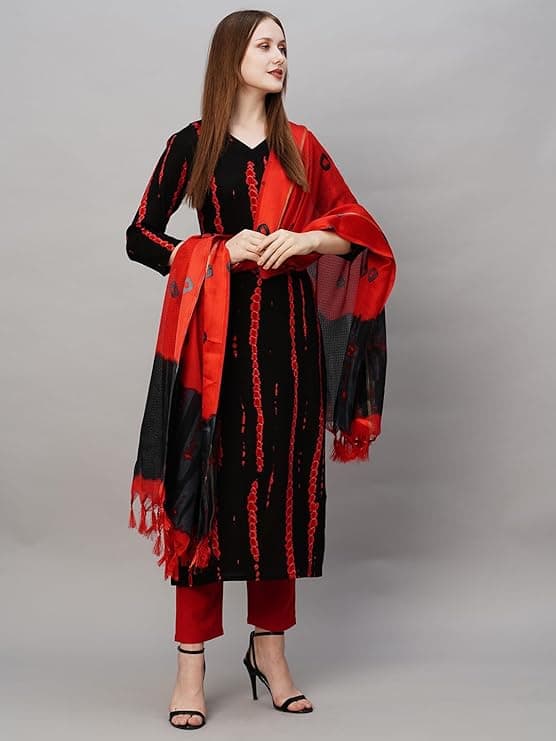 Woman wearing a maroon party wear ethnic kurta style by Nishtha Chadda
