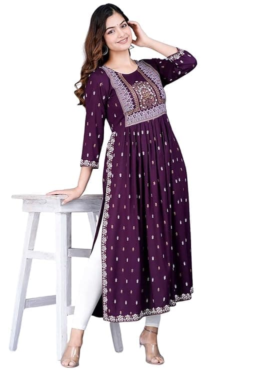 Woman wearing a maroon party wear ethnic kurta style by Nishtha Chadda
