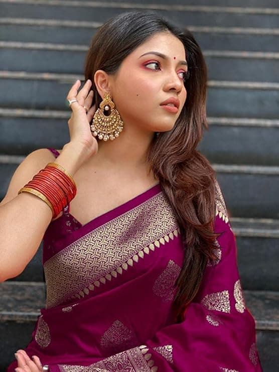 Woman wearing a maroon party wear ethnic kurta style by Nishtha Chadda
