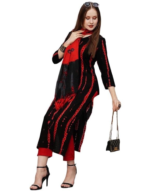 Woman wearing a maroon party wear ethnic kurta style by Nishtha Chadda