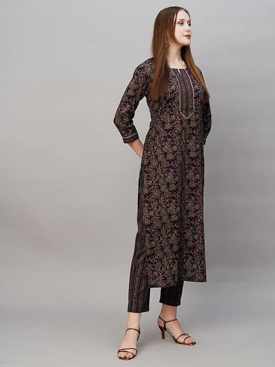 Woman wearing a brown party wear ethnic kurta style by Nishtha Chadda