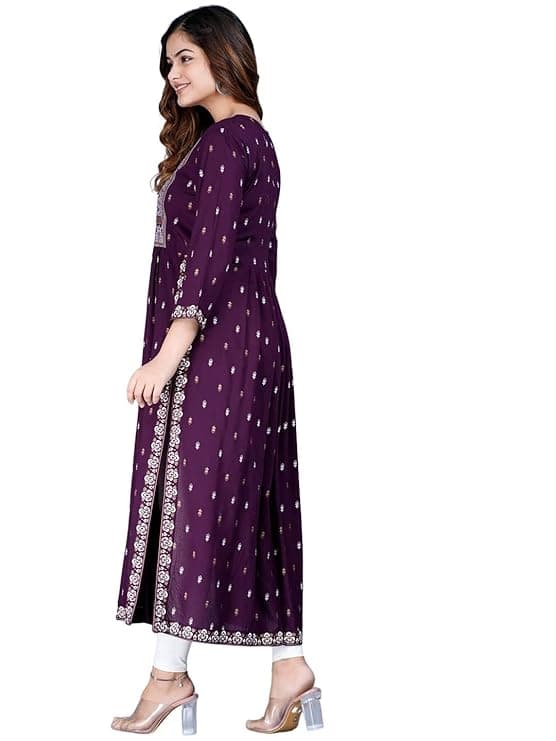 Woman wearing a maroon party wear ethnic kurta style by Nishtha Chadda