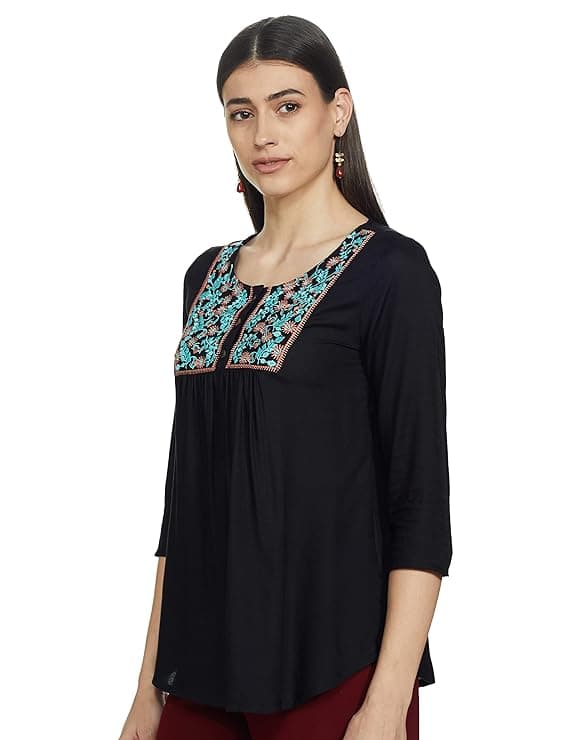 Woman wearing a grey party wear ethnic kurta style by Nishtha Chadda