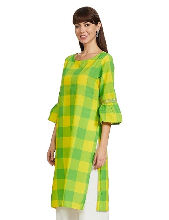 Woman wearing a mustard party wear ethnic kurta style by Nishtha Chadda