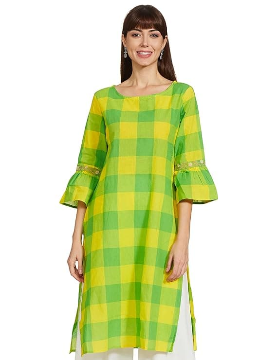 Woman wearing a mustard party wear ethnic kurta style by Nishtha Chadda