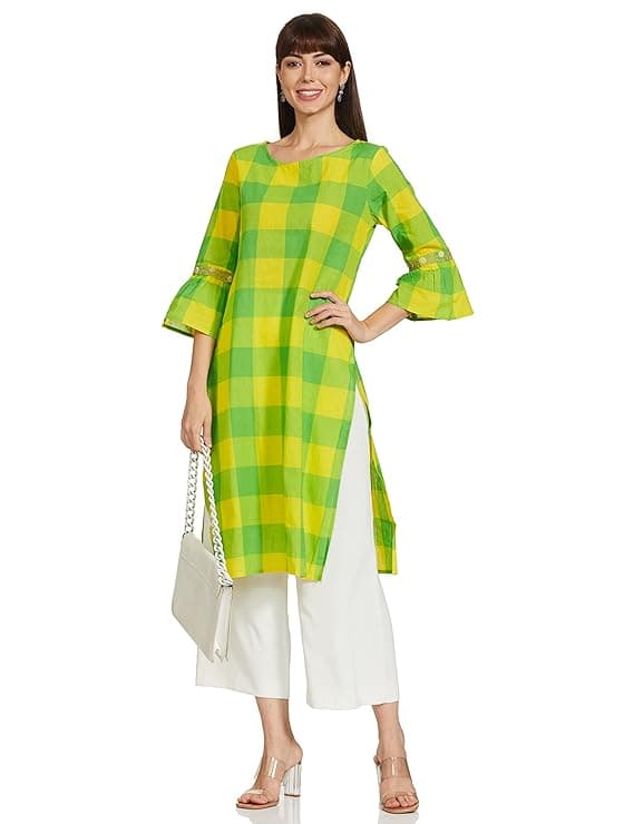 Woman wearing a mustard party wear ethnic kurta style by Nishtha Chadda