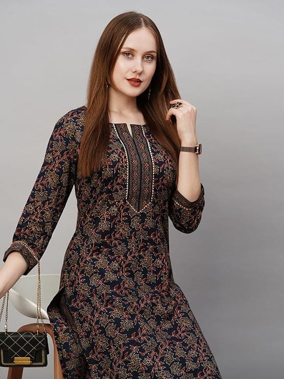 Woman wearing a brown party wear ethnic kurta style by Nishtha Chadda