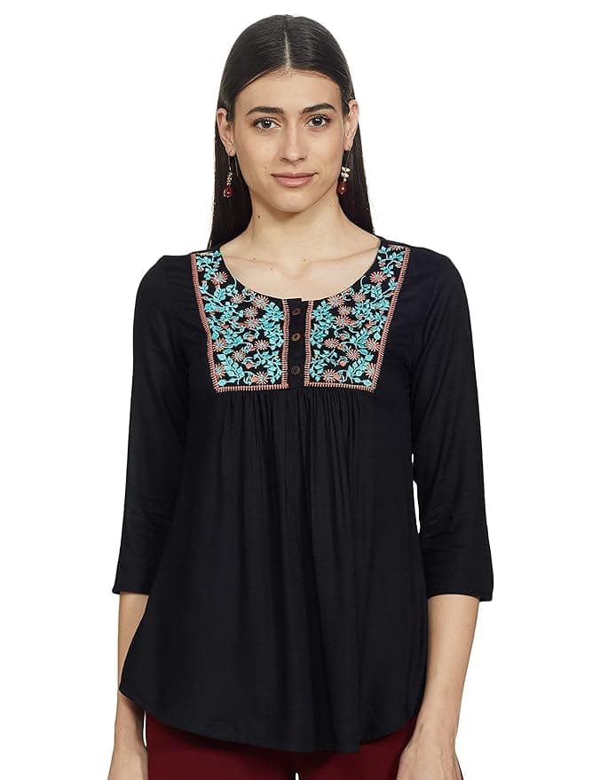 Woman wearing a grey party wear ethnic kurta style by Nishtha Chadda