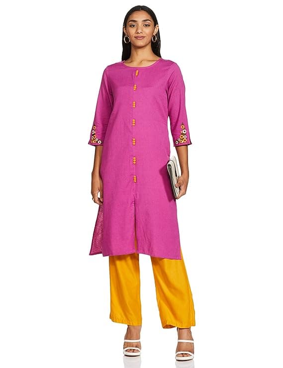 Woman wearing a coral party wear ethnic kurta style by Nishtha Chadda