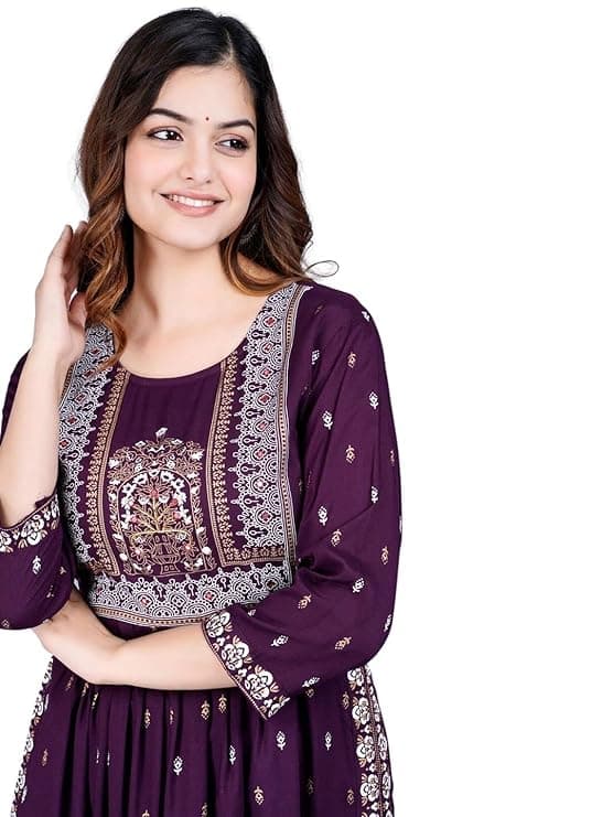 Woman wearing a maroon party wear ethnic kurta style by Nishtha Chadda