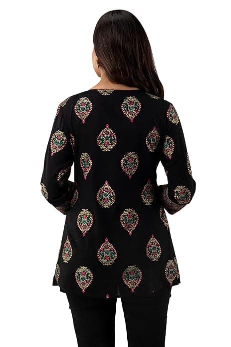 Woman wearing a maroon party wear ethnic kurta style by Nishtha Chadda