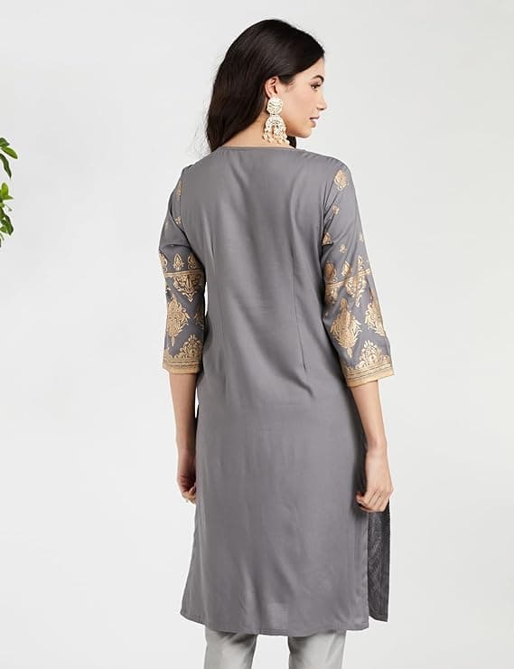 Woman wearing a grey party wear ethnic kurta style by Nishtha Chadda