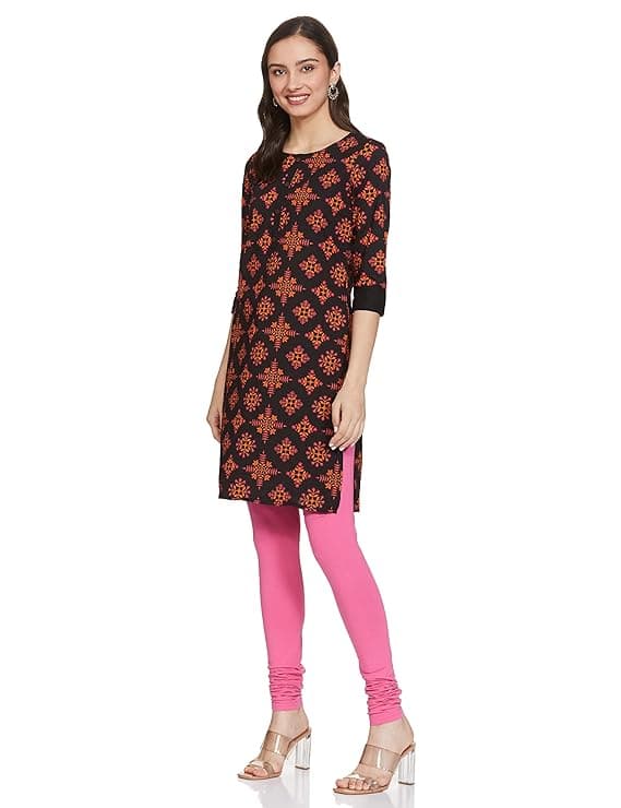 Woman wearing a brown party wear ethnic kurta style by Nishtha Chadda