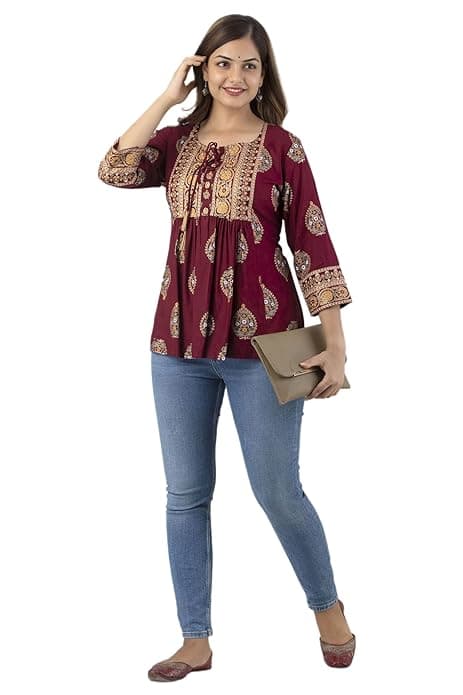 Woman wearing a brown party wear ethnic kurta style by Nishtha Chadda